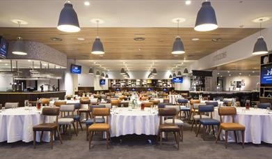 Hospitality suite with chairs and tables set out at Manchester City Football Club