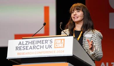 conference speaker at a lectern